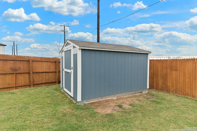 view of outdoor structure featuring a lawn