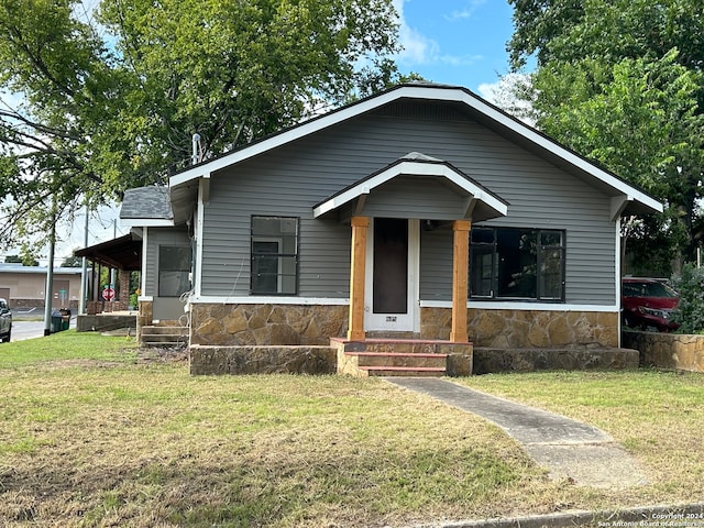 bungalow-style house with a front yard