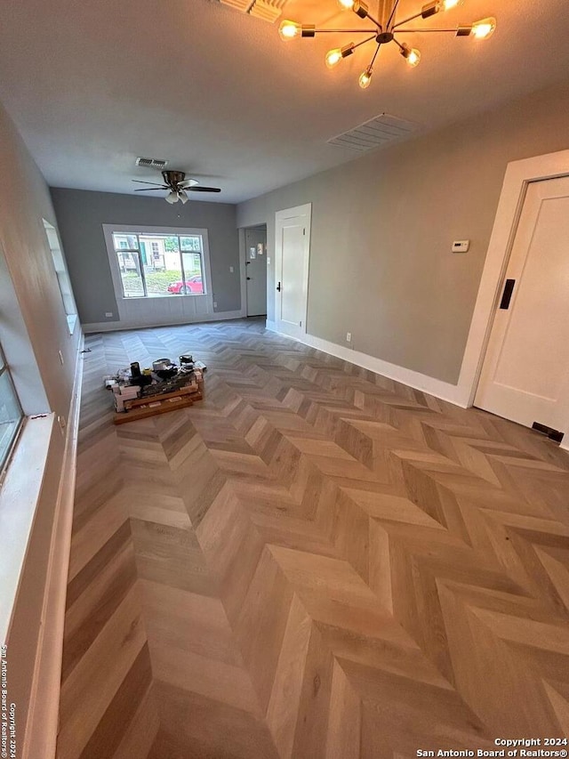 interior space with light parquet flooring and ceiling fan