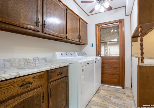 laundry room featuring cabinets, washing machine and clothes dryer, and ceiling fan