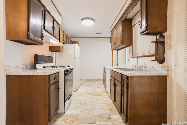 kitchen with sink and white gas range oven