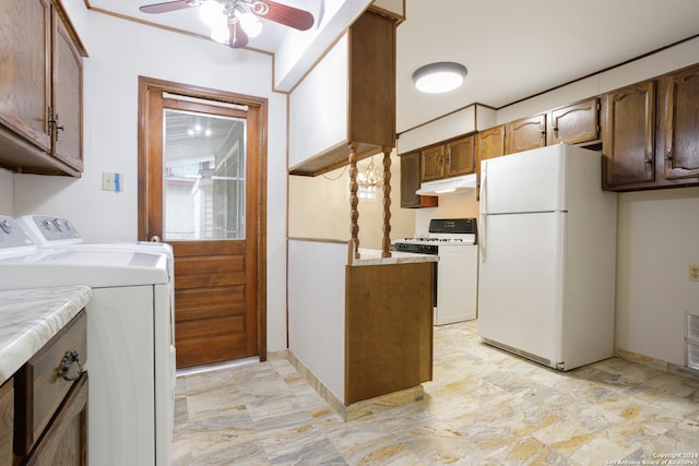 kitchen featuring ceiling fan, white appliances, and washing machine and clothes dryer