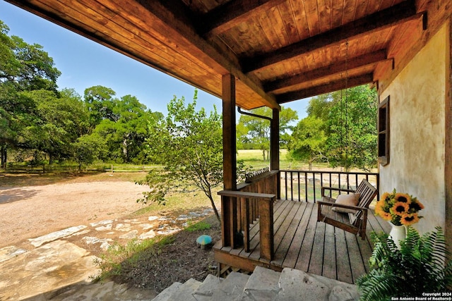 wooden terrace with a porch