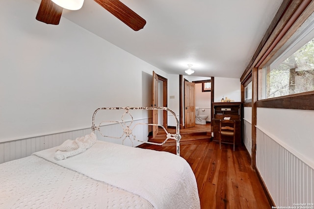 bedroom featuring hardwood / wood-style flooring, lofted ceiling, and ceiling fan