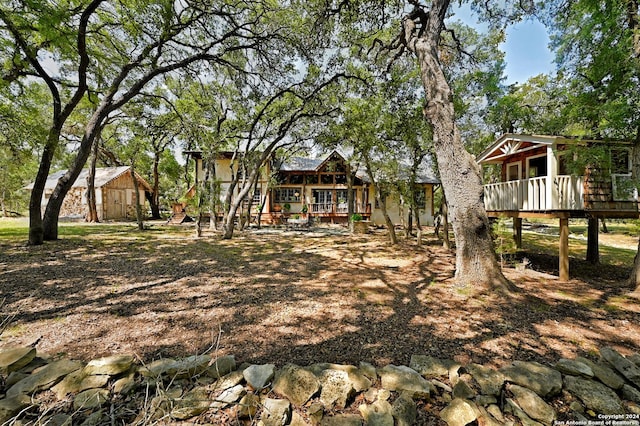 view of yard with a wooden deck