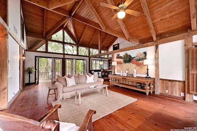 living room with beam ceiling, high vaulted ceiling, hardwood / wood-style floors, and wooden ceiling