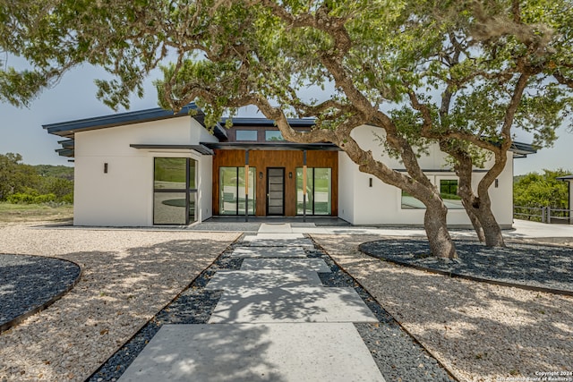 rear view of property featuring a patio area