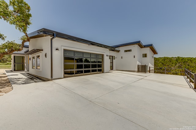 view of property exterior with a garage