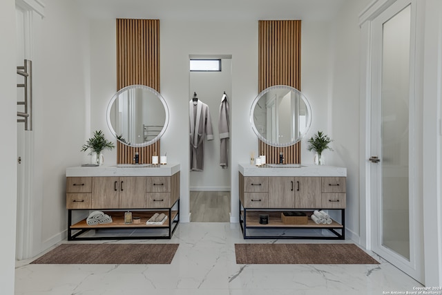 bathroom featuring dual vanity and hardwood / wood-style flooring