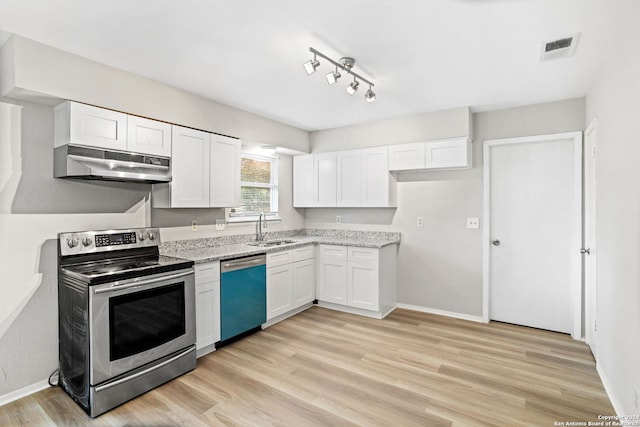 kitchen featuring sink, white cabinetry, light hardwood / wood-style flooring, stainless steel appliances, and light stone countertops