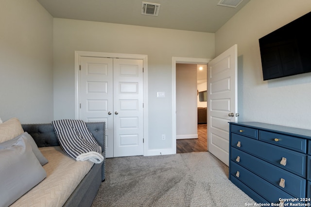 bedroom featuring a closet and carpet flooring