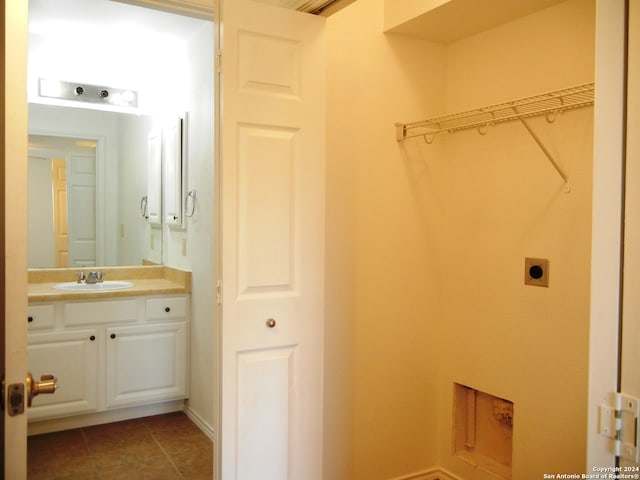 bathroom with tile patterned flooring and vanity