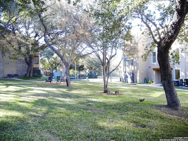 view of home's community with a lawn