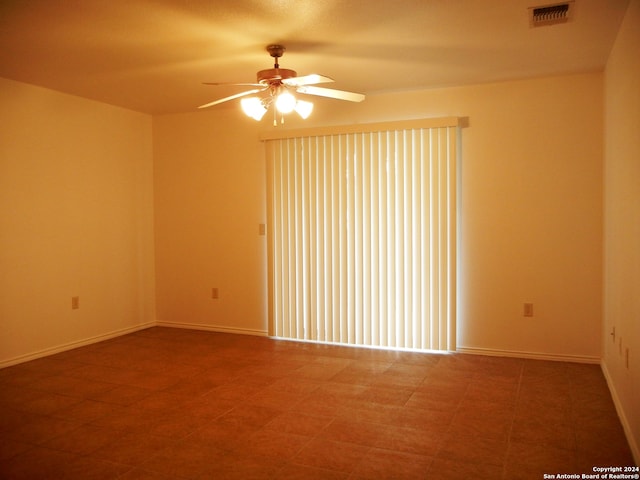 unfurnished room with ceiling fan