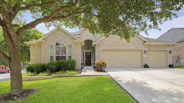 single story home with a garage and a front yard