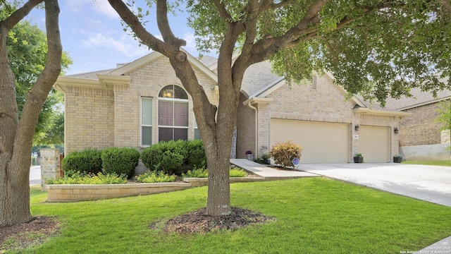 ranch-style house with a garage and a front yard