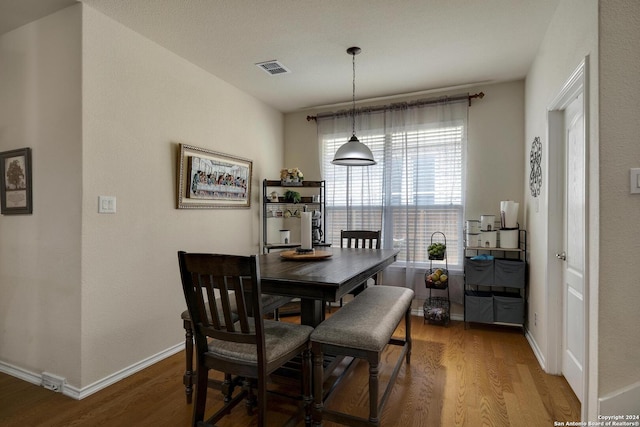 dining room featuring wood-type flooring