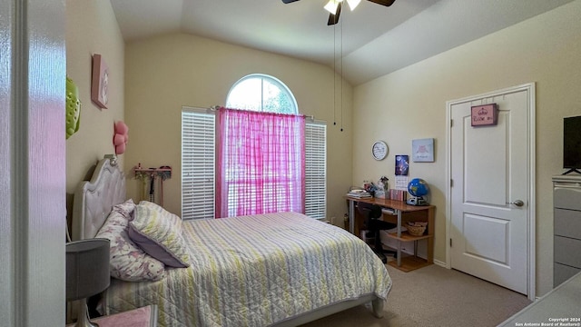 carpeted bedroom with ceiling fan and vaulted ceiling