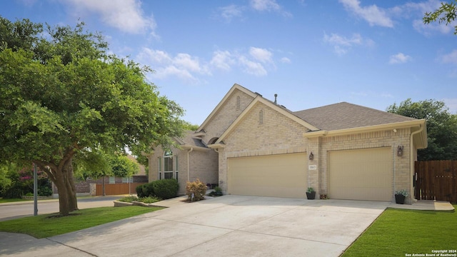 view of front facade featuring a garage and a front lawn