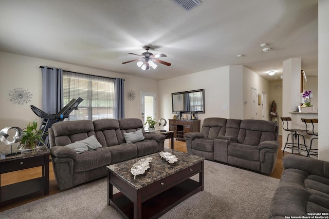 living room featuring ceiling fan