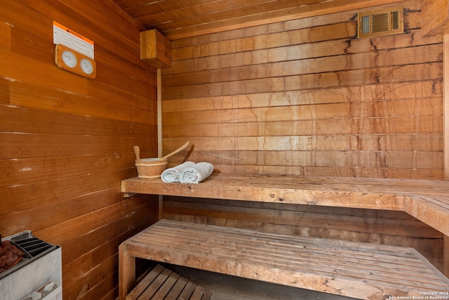 view of sauna / steam room with wood walls and wooden ceiling