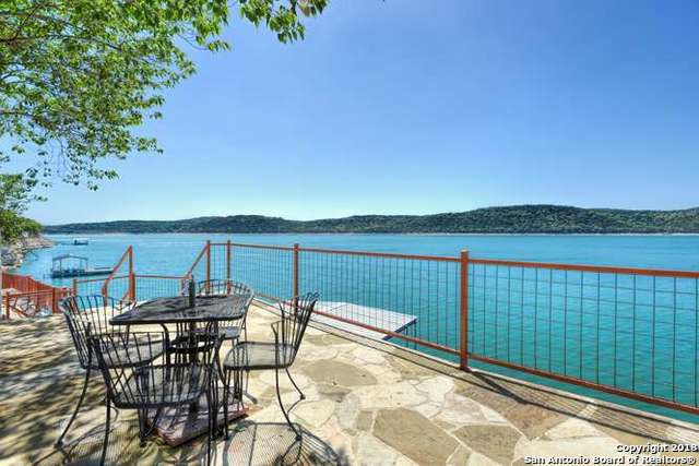 696 Faurie Rd, Lakehills, TX 78063 - balcony with outdoor dining area and a water view