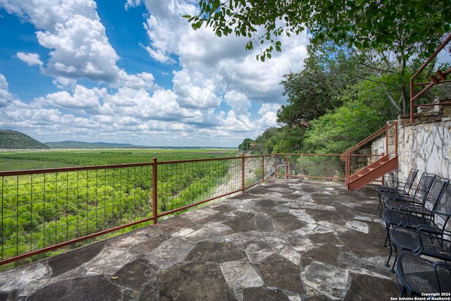 view of patio / terrace with a rural view