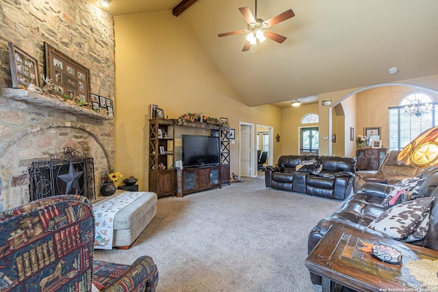 217 Meadowlark Ln, Mcqueeney, TX 78123 - living room with ceiling fan with notable chandelier, high vaulted ceiling, a fireplace, carpet floors, and beam ceiling
