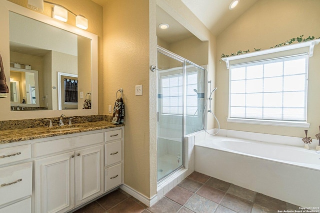 217 Meadowlark Ln, Mcqueeney, TX 78123 - bathroom with vanity, vaulted ceiling, and plus walk in shower