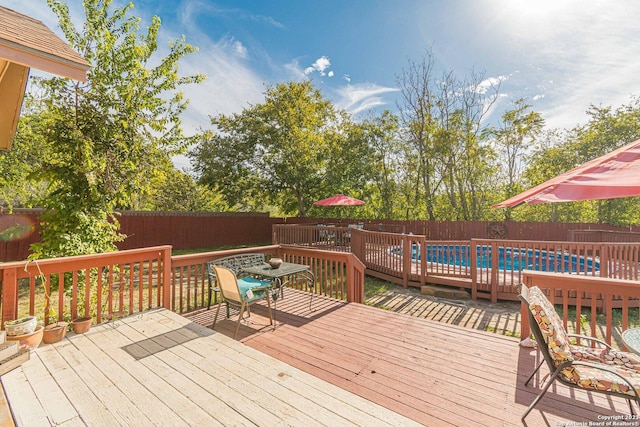 217 Meadowlark Ln, Mcqueeney, TX 78123 - deck with a fenced in pool