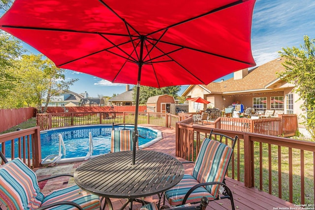 217 Meadowlark Ln, Mcqueeney, TX 78123 - view of pool with a wooden deck and a storage unit