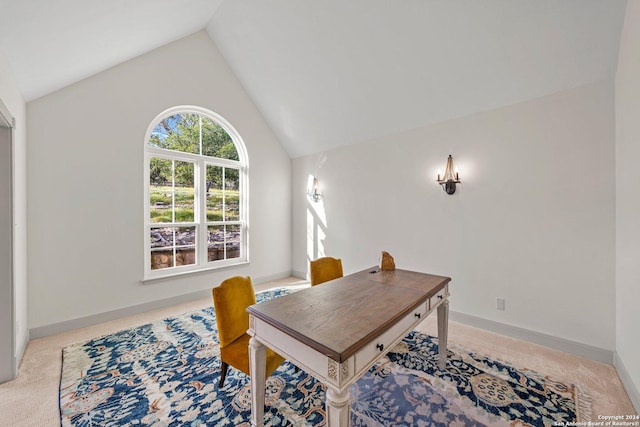 carpeted office featuring high vaulted ceiling