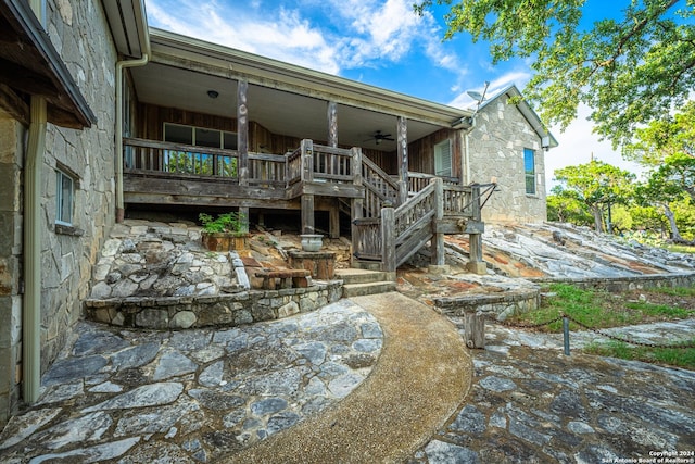 rear view of property with a patio area and ceiling fan