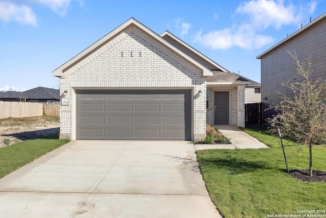 view of front of house with a garage and a front yard