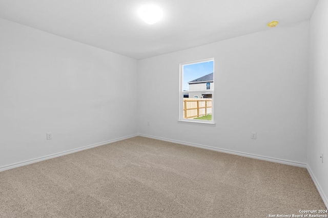 empty room featuring carpet floors