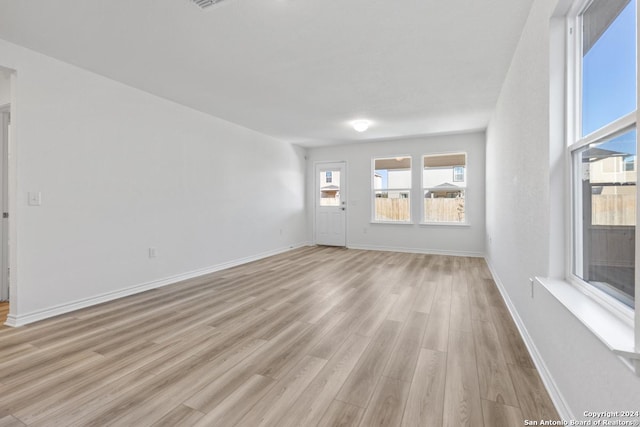 spare room with light wood-type flooring