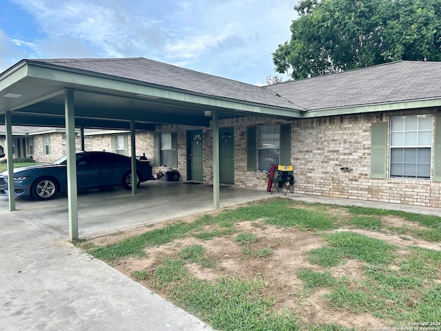 view of front of home with a carport