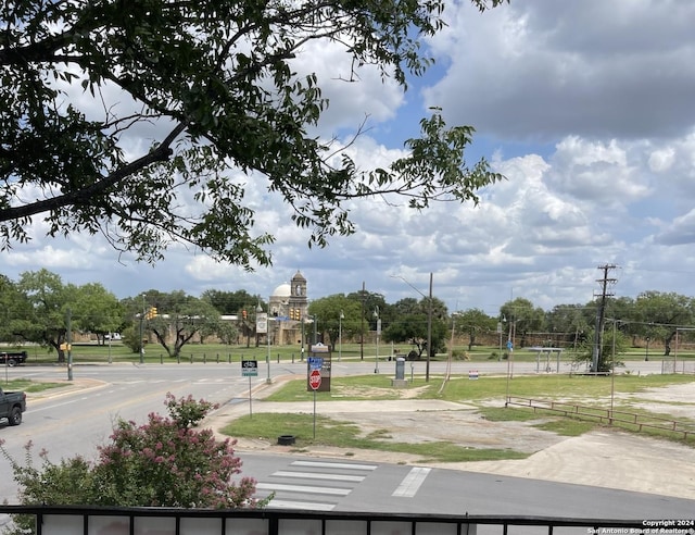 view of street featuring traffic signs and sidewalks