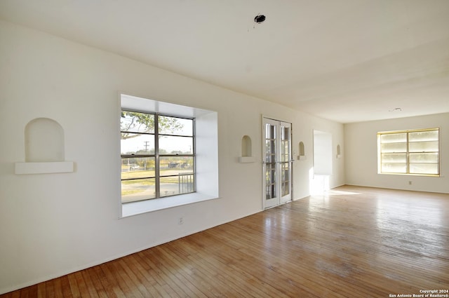 spare room with wood-type flooring