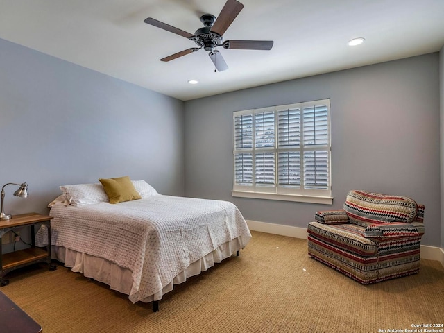 bedroom with light carpet, ceiling fan, baseboards, and recessed lighting