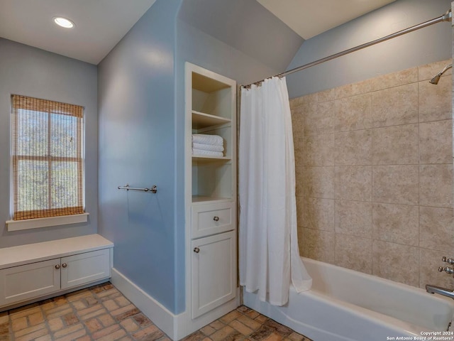 bathroom featuring baseboards, recessed lighting, brick floor, and shower / tub combo with curtain