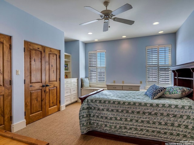 bedroom with ceiling fan, recessed lighting, and light colored carpet