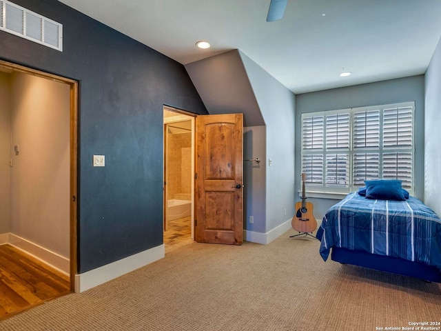 unfurnished bedroom with recessed lighting, visible vents, light carpet, ensuite bath, and baseboards