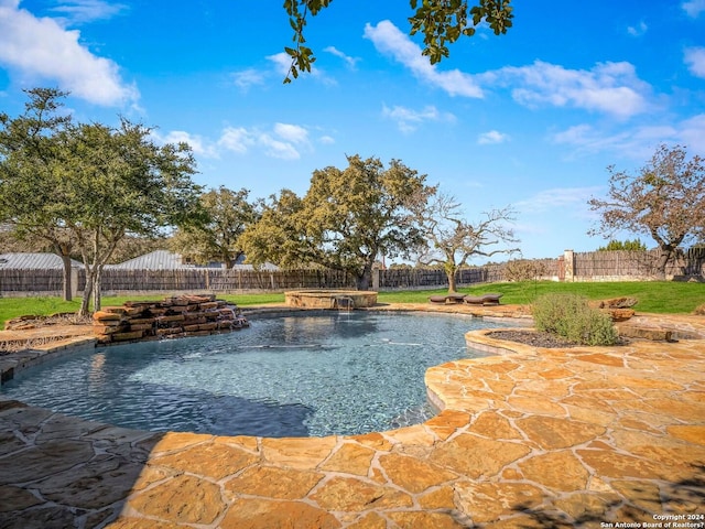 view of pool featuring an in ground hot tub, a patio area, a fenced backyard, and a fenced in pool