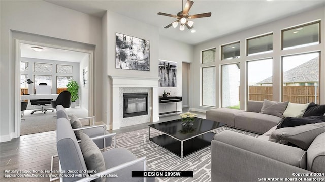 living room with hardwood / wood-style floors and ceiling fan