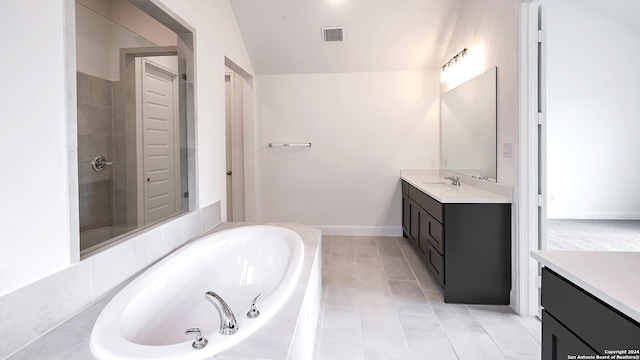 bathroom featuring vanity, tile patterned floors, and shower with separate bathtub