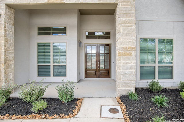 entrance to property featuring french doors