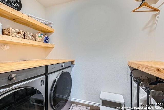 laundry area with washing machine and clothes dryer