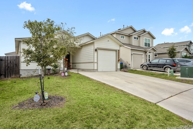 view of front of property featuring a garage and a front yard