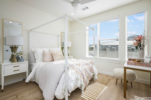 bedroom with hardwood / wood-style floors and ceiling fan